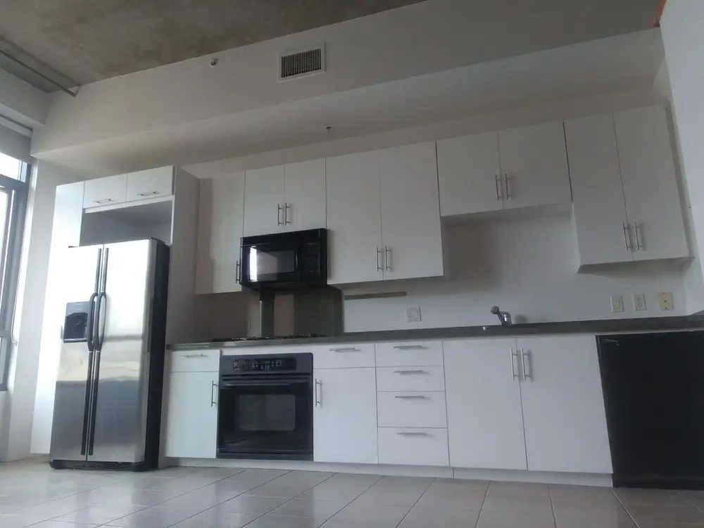 Refinished white kitchen cabinets