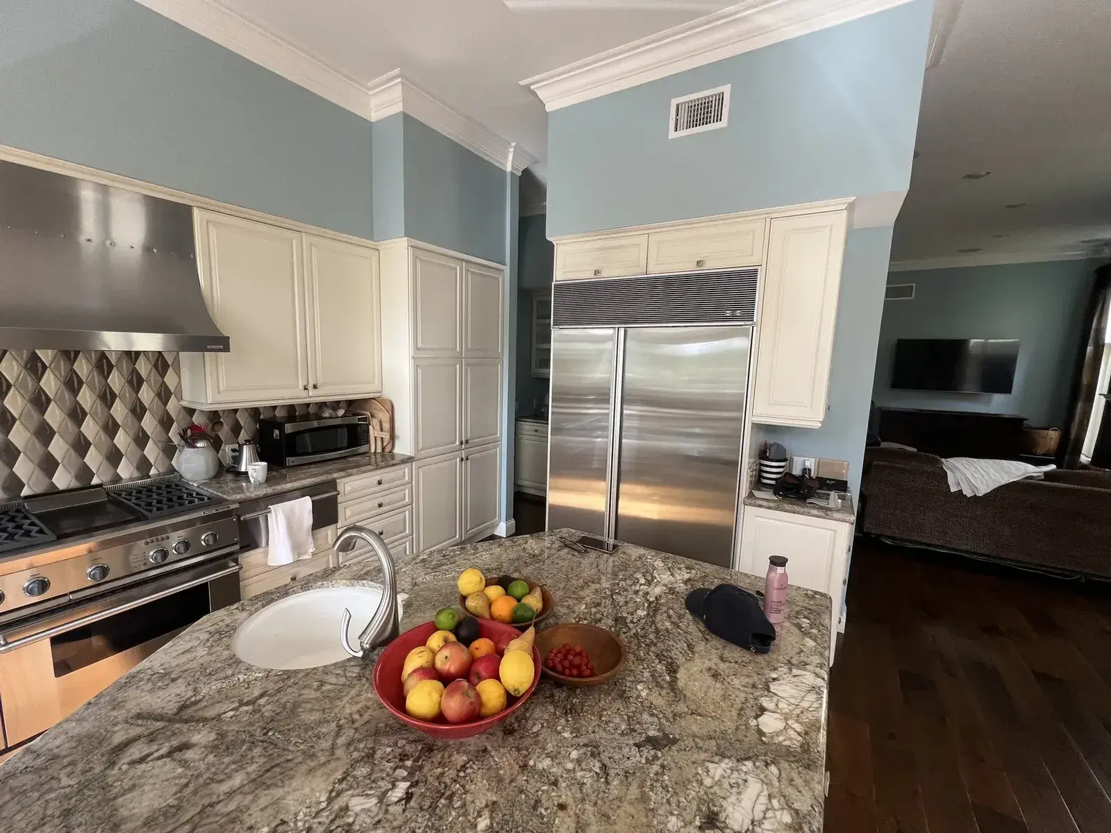 Dated painted cabinets before refinishing — the kind of aging finish this guide explains